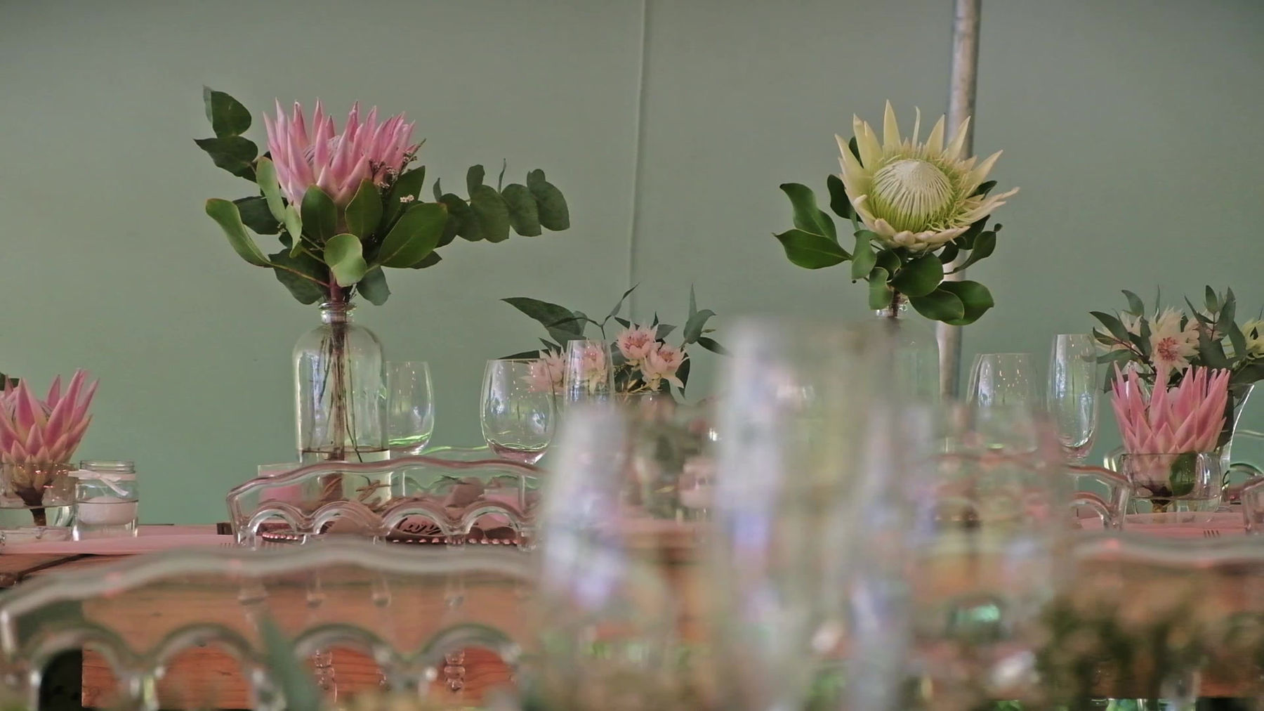 Styled tablescape with protea florals and elegant place settings