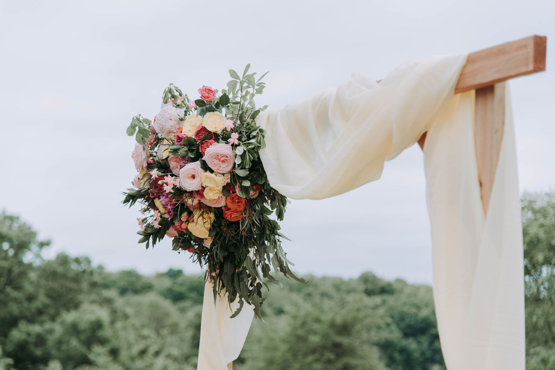 Floral wedding arch overlooking the Texas countryside